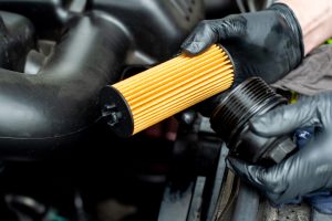 replacing-a-car-s-oil-filter-with-black-gloves-2026-03-16-05-10-26-utc